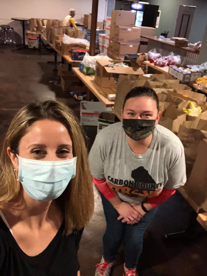 2 people working at food pantry